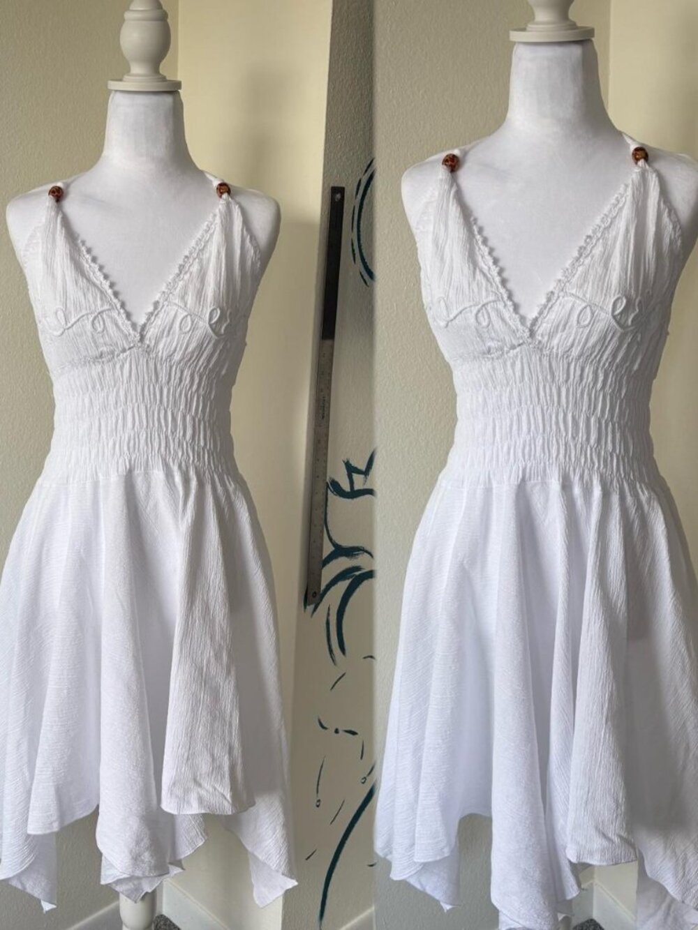 White Halter beach dress with smocked waist and handkerchief hemline embroidered
